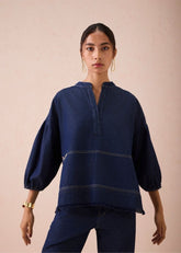 A Model Wearing Blue Denim The Little Things Denim Blouse, curated by Only Ethikal